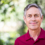 Portrait of a beautiful senior man in nature